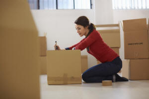Woman Packing Boxes